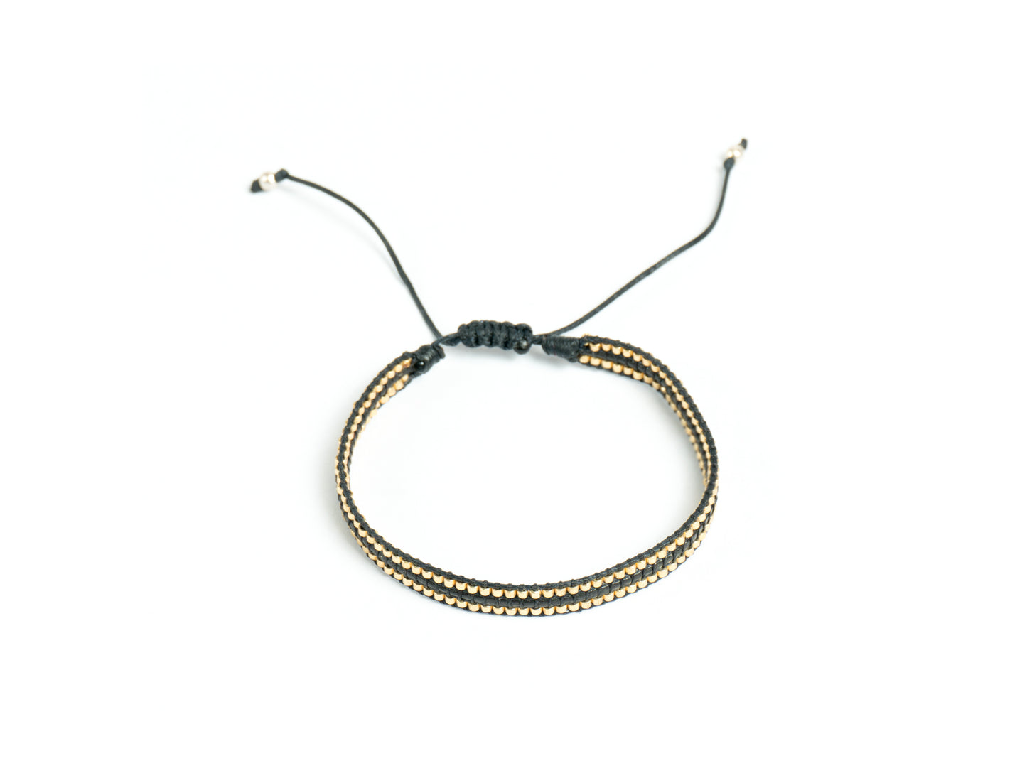 Pulsera Miyuki y cuero encerado negro dorado