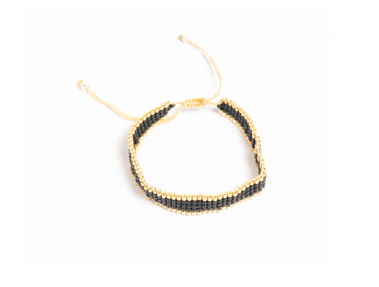 Pulsera Miyuki chica negro orilla dorado