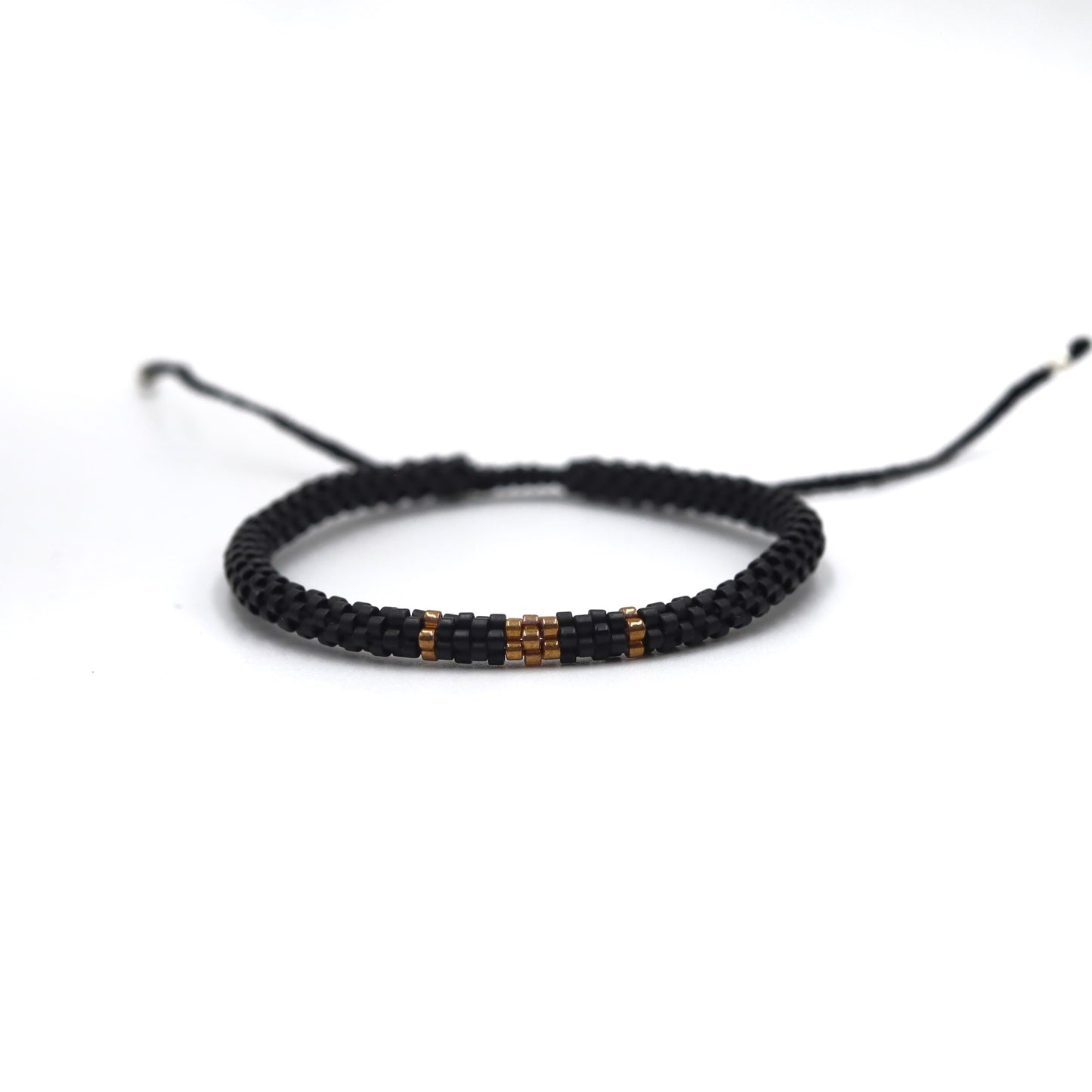 Pulsera Miyuki Caballero redonda negro centro ocre