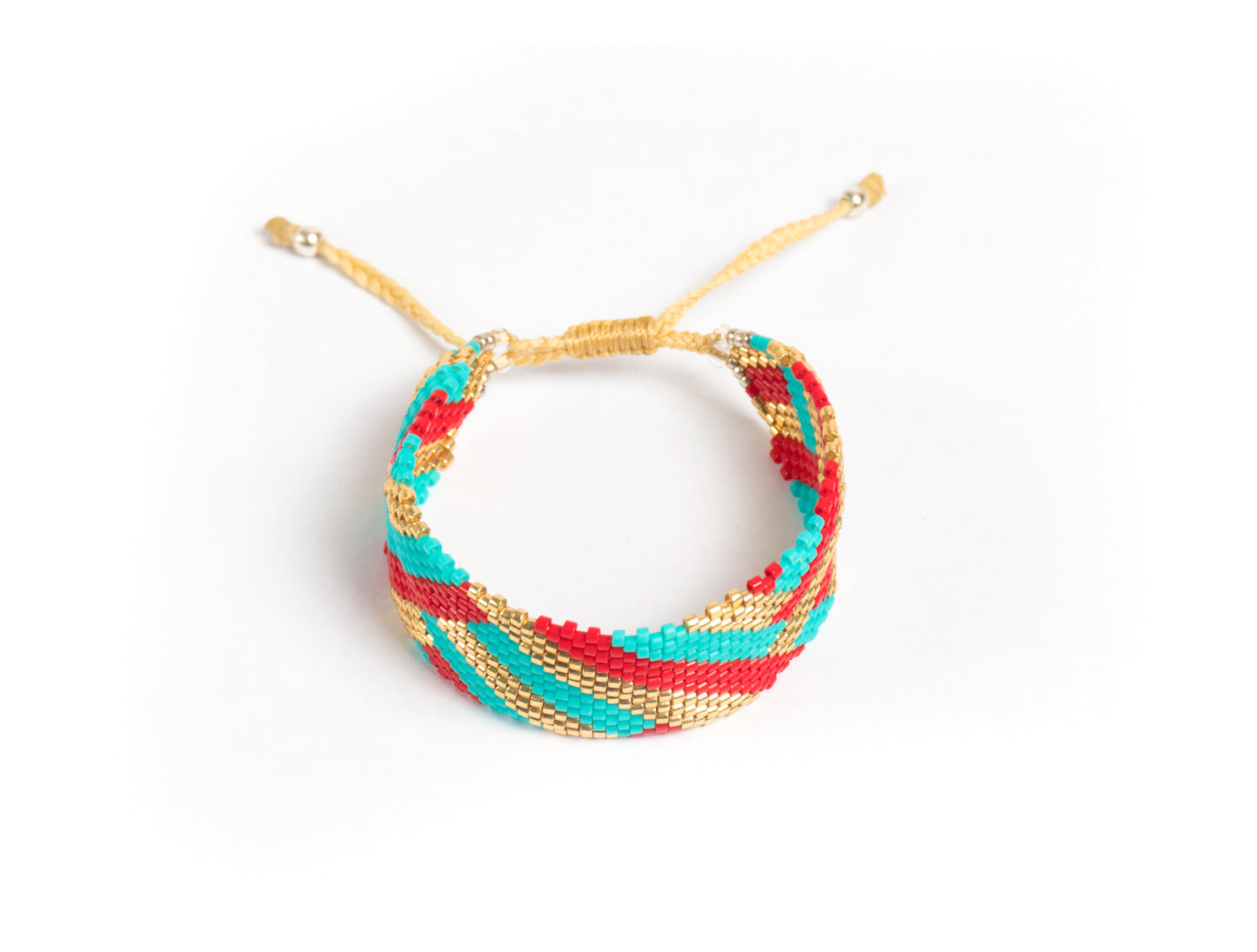 Pulsera Miyuki grande lineas oro turqueza rojo