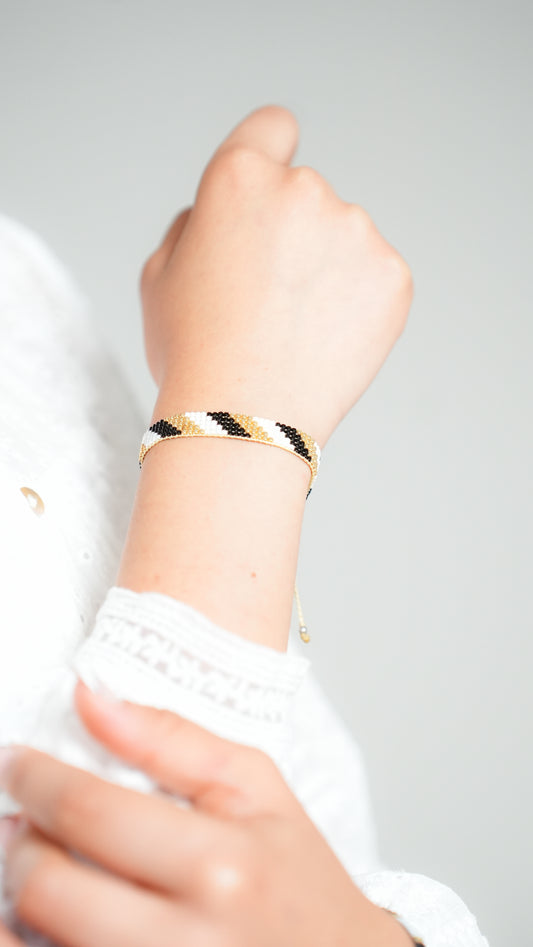 Pulsera Miyuki chica diagonal negro oro blanco