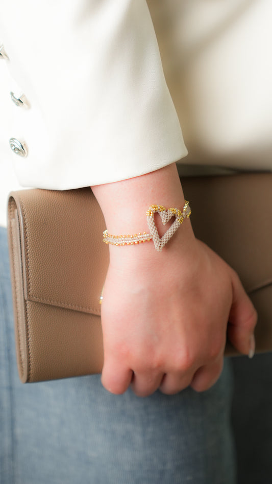 Pulsera Miyuki corazón nude oro 3D