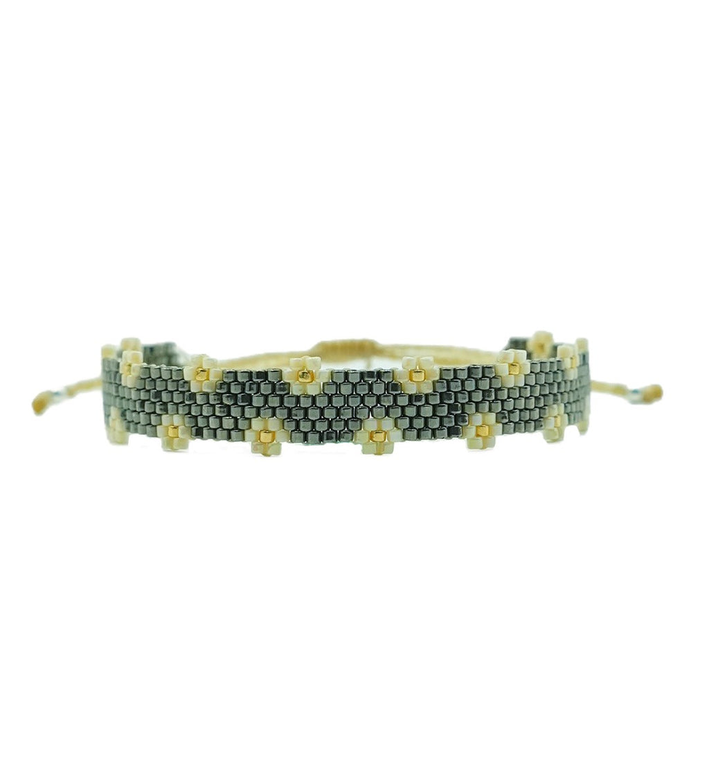 PULSERA OXFORD CON FLORES NUDE