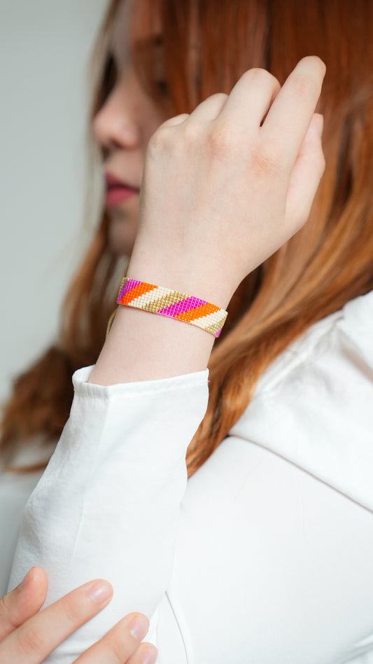 Brazalete Miyuki diagonales magenta naranja nude oro