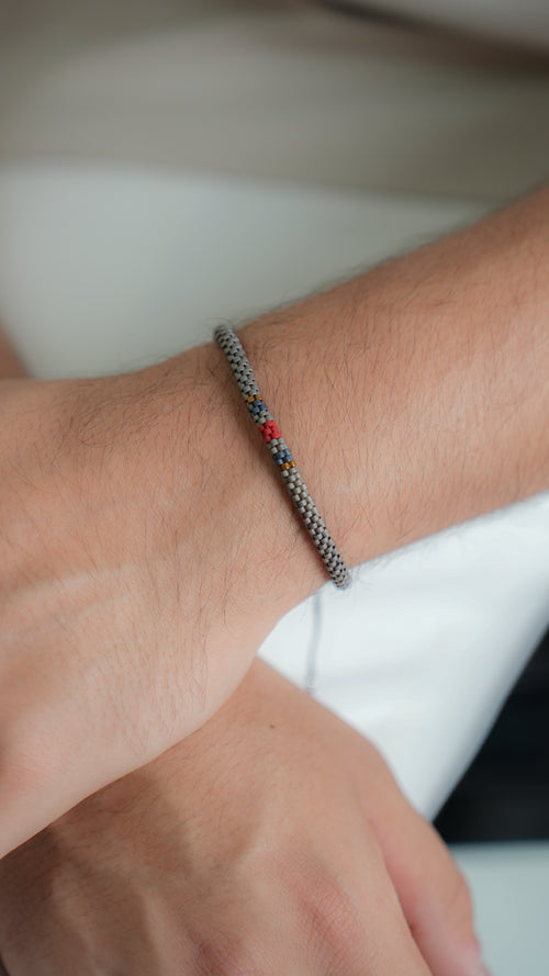 Pulsera Miyuki Caballero redonda gris centro tinto marino ocre