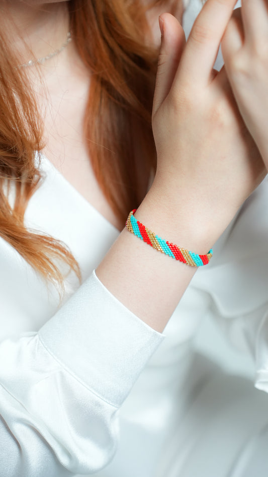 Pulsera Miyuki chica lineas oro turquesa rojo