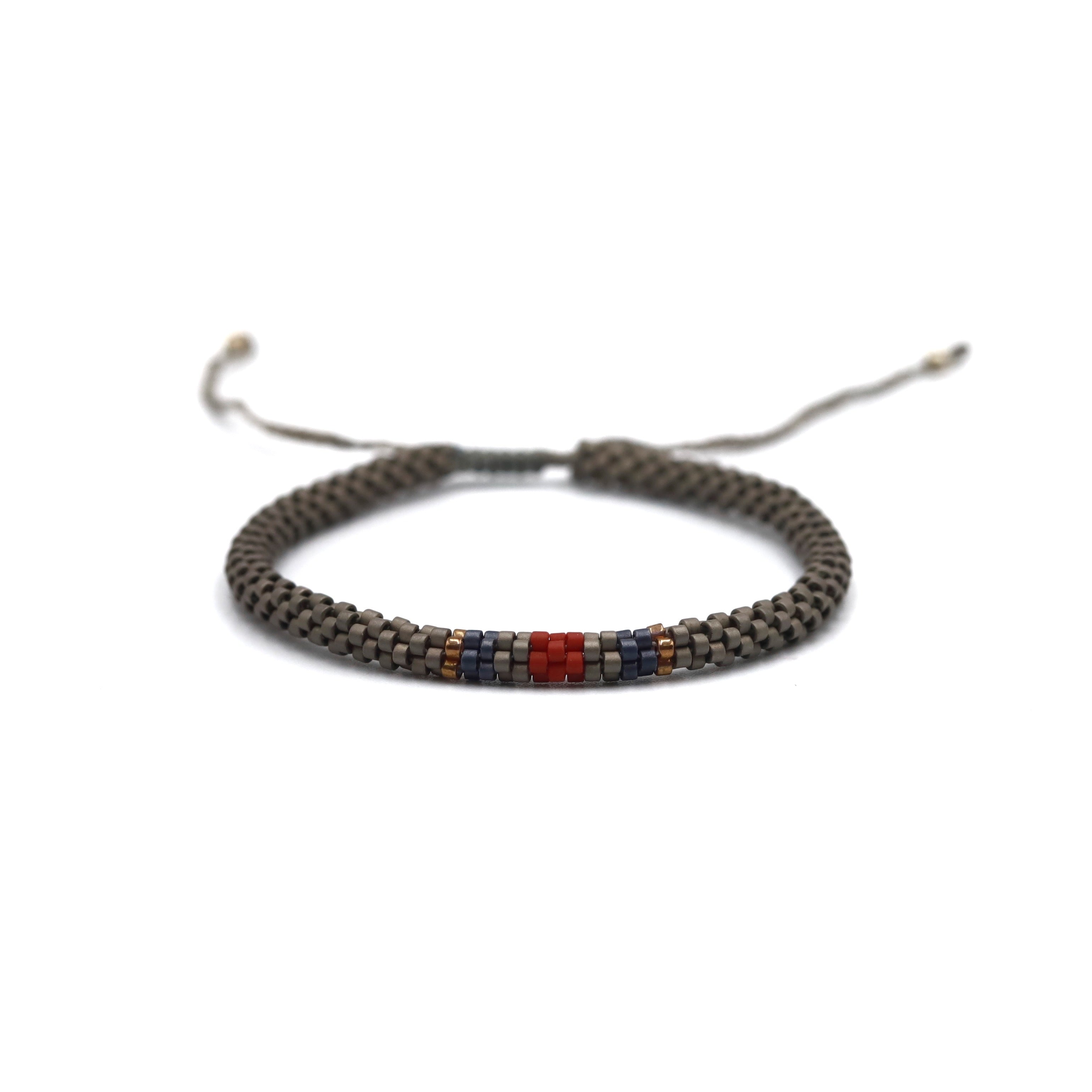 Pulsera Miyuki Caballero redonda gris centro tinto marino ocre