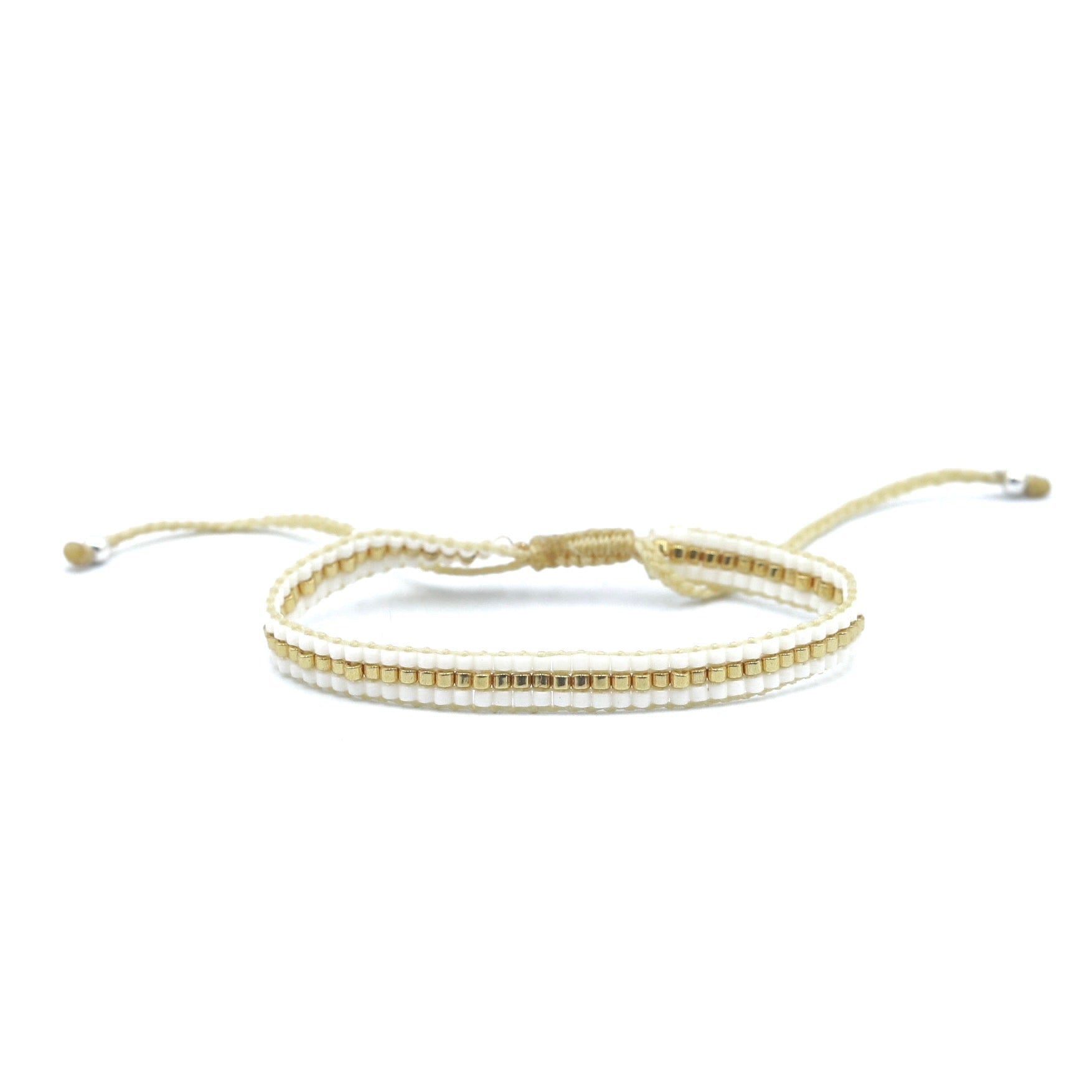 Pulsera Miyuki 3 lineas blanco centro dorado