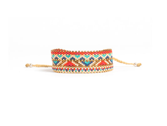 Pulsera Miyuki grande lineas doradas y grecas rojo azul