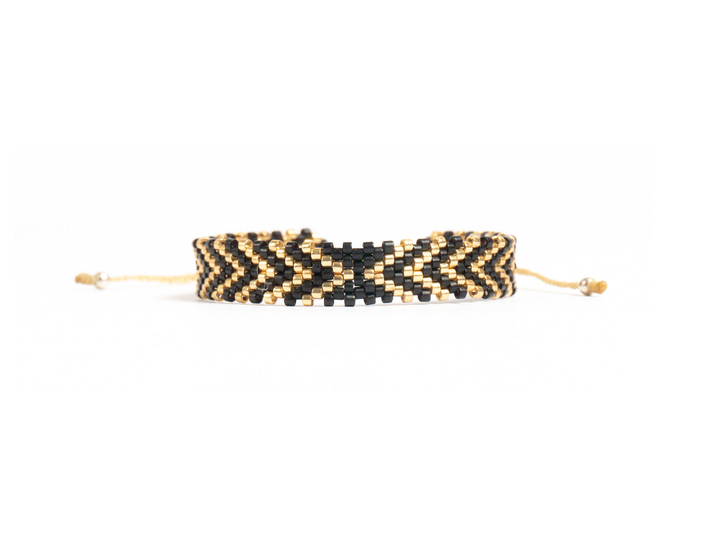 Pulsera Miyuki chica flechas negro dorado