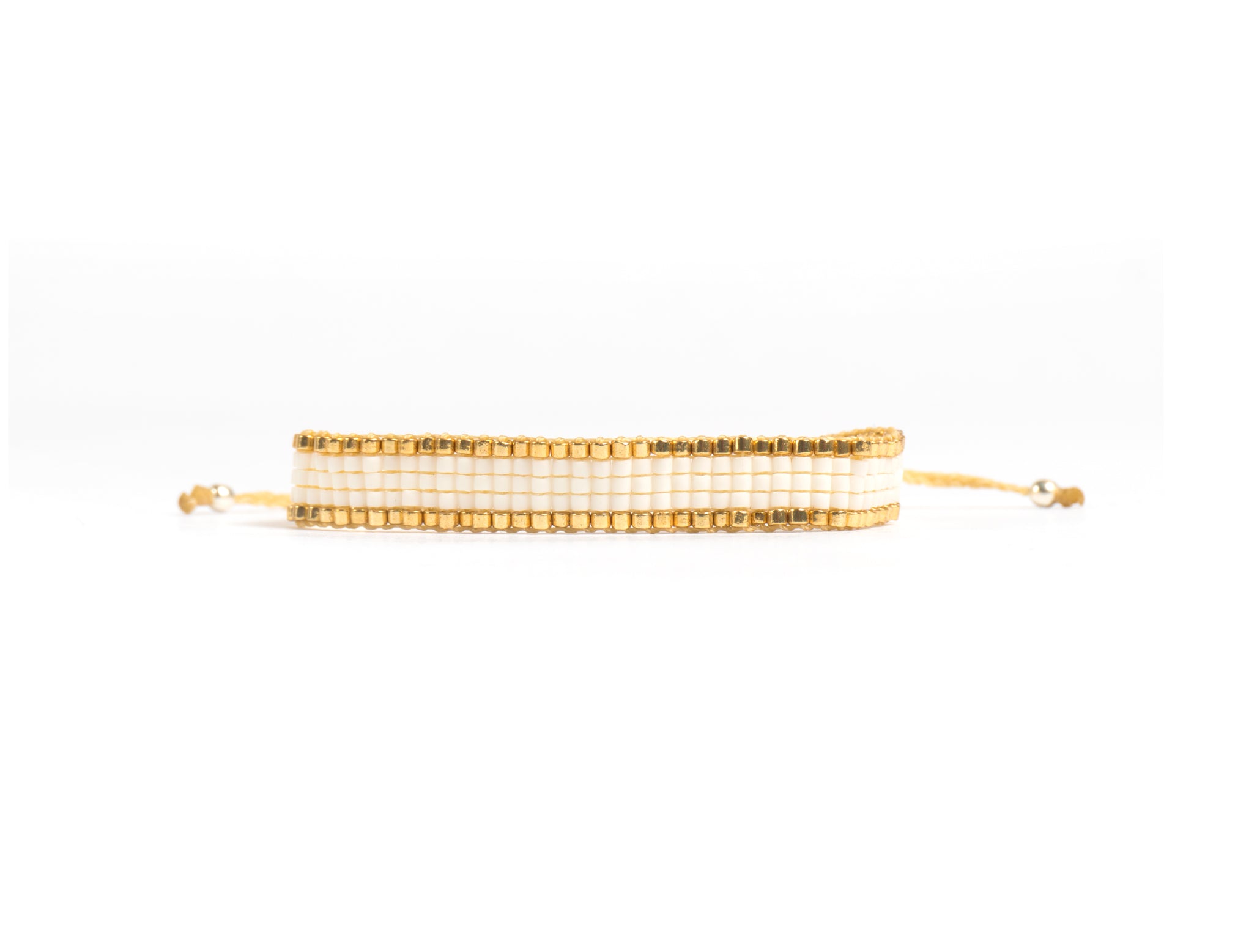 Pulsera Miyuki chica blanco orilla dorado