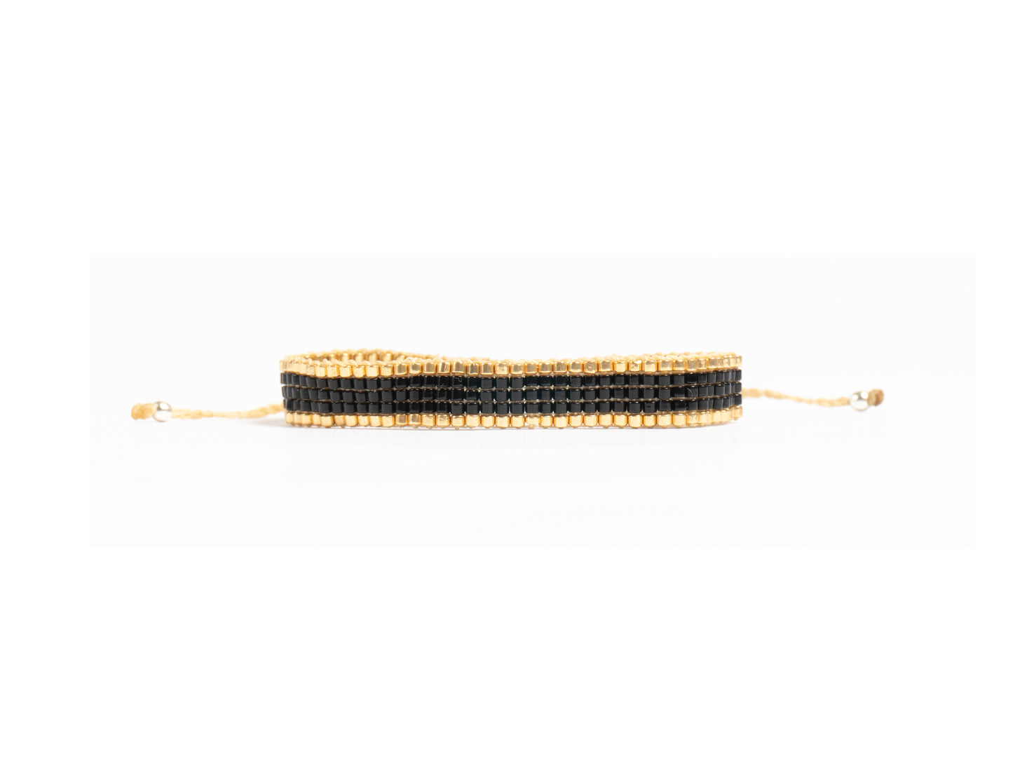 Pulsera Miyuki chica negro orilla dorado