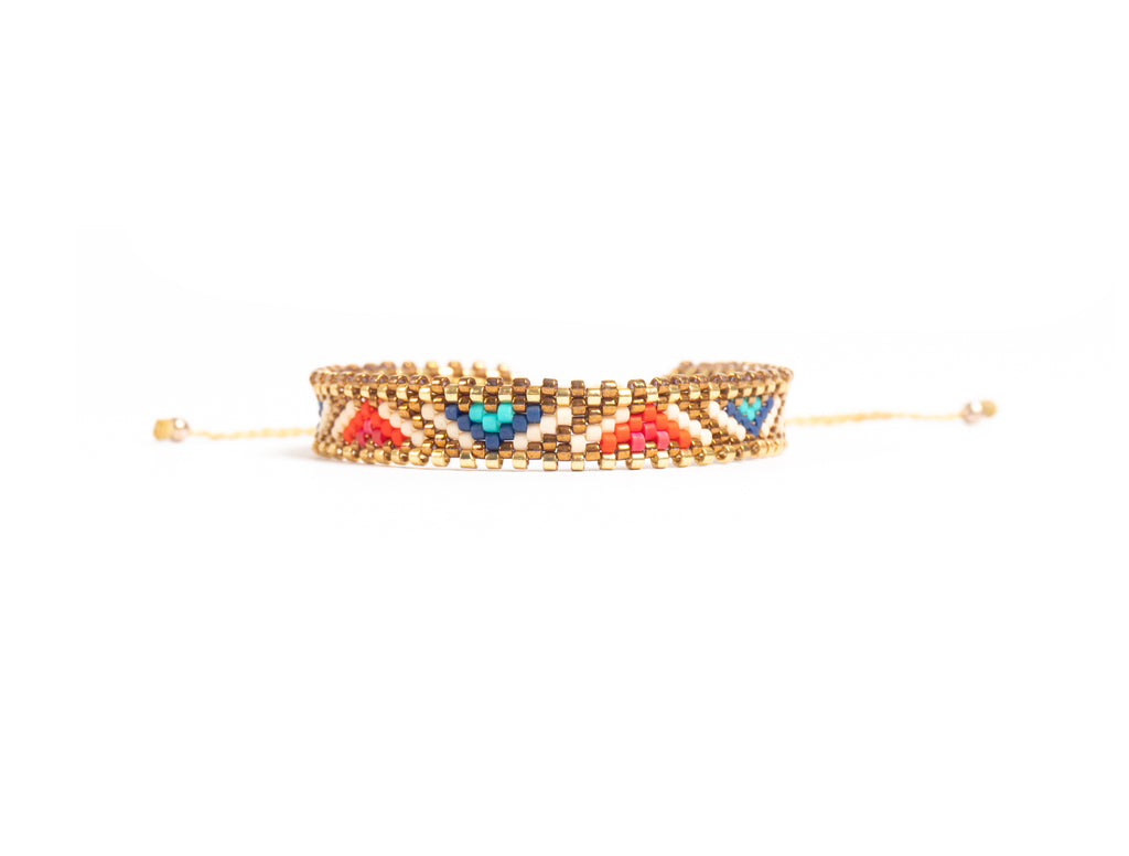 Pulsera Miyuki chica lineas doradas y triangulos rojo azul