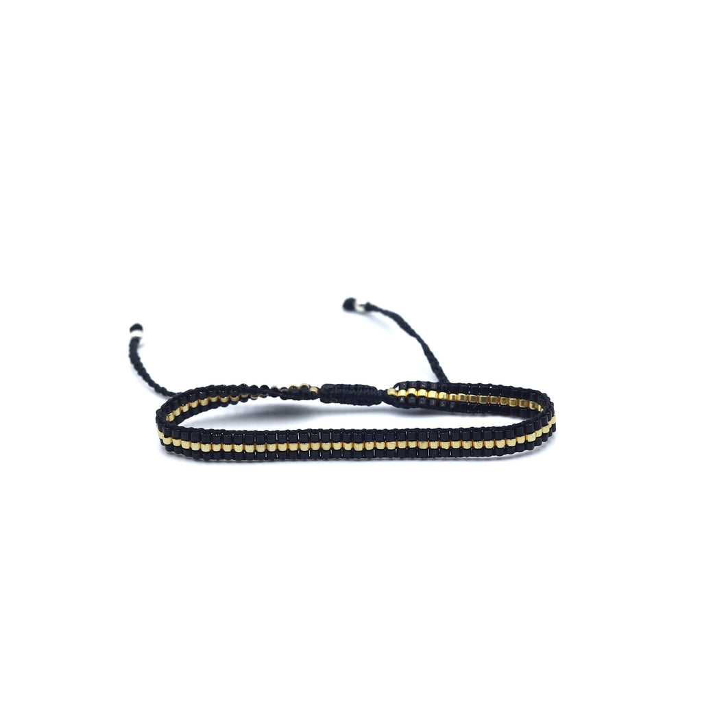 Pulsera MIYUKI 3 lineas negro centro dorado